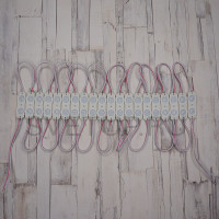 Светодиодный модуль с линзой SMD2835X2, 12 V, 1W IP67, 45*14 мм. 